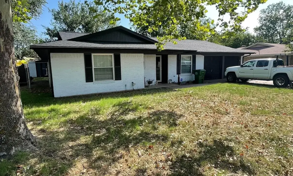Professional roofing crew working on a residential roof in West Allis